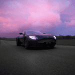 2021 Aston Martin DB11 driving at dusk