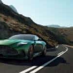 2024 Aston Martin DB12 driving along mountain highway