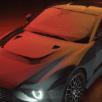 2024 Aston Martin Valour parked in front of orange background