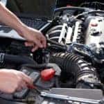 Professional car mechanic working in auto repair service.