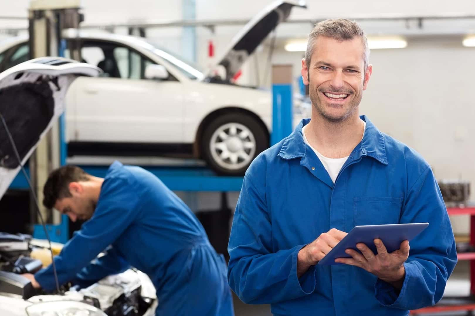 Service technicians working on a Chevrolet vehicle