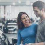 A coupe is looking at an affordable used car.