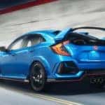 A blue 2021 Honda Civic Type R is shown from the rear driving through a tunnel towards a greater Atlanta Honda dealer.