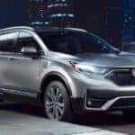 A silver 2021 Honda CR-V is parked on a city street after leaving an Atlanta Honda CR-V dealer.