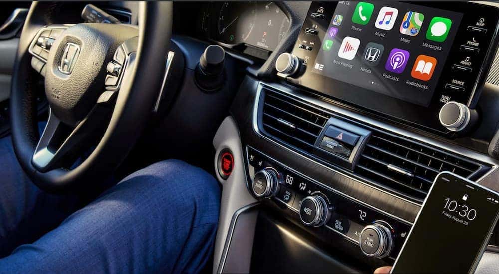 A close up shows the center console and steering wheel on a 2019 Honda Accord.