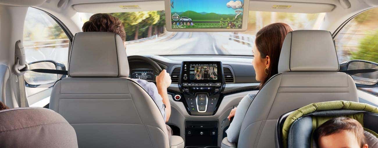 The infotainment screens are shown from the middle seats in a 2022 Honda Odyssey Elite.