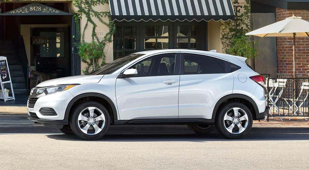 A white 2021 Honda HR-V is shown parked on a city street after selling their car.