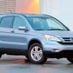 A light blue 2011 Honda CR-V is shown from the front at an angle after leaving a dealer that advertised having a used Honda CR-V.