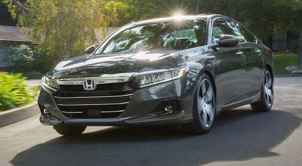 A grey 2022 Honda Accord Hybrid is shown from the front at an angle after leaving an Atlanta car dealership.