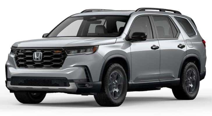 A grey 2023 Honda Pilot Trailsport is shown angled left.