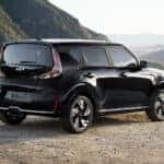 A picture of a black 2025 Kia Soul parked and overlooking a mountain pass.