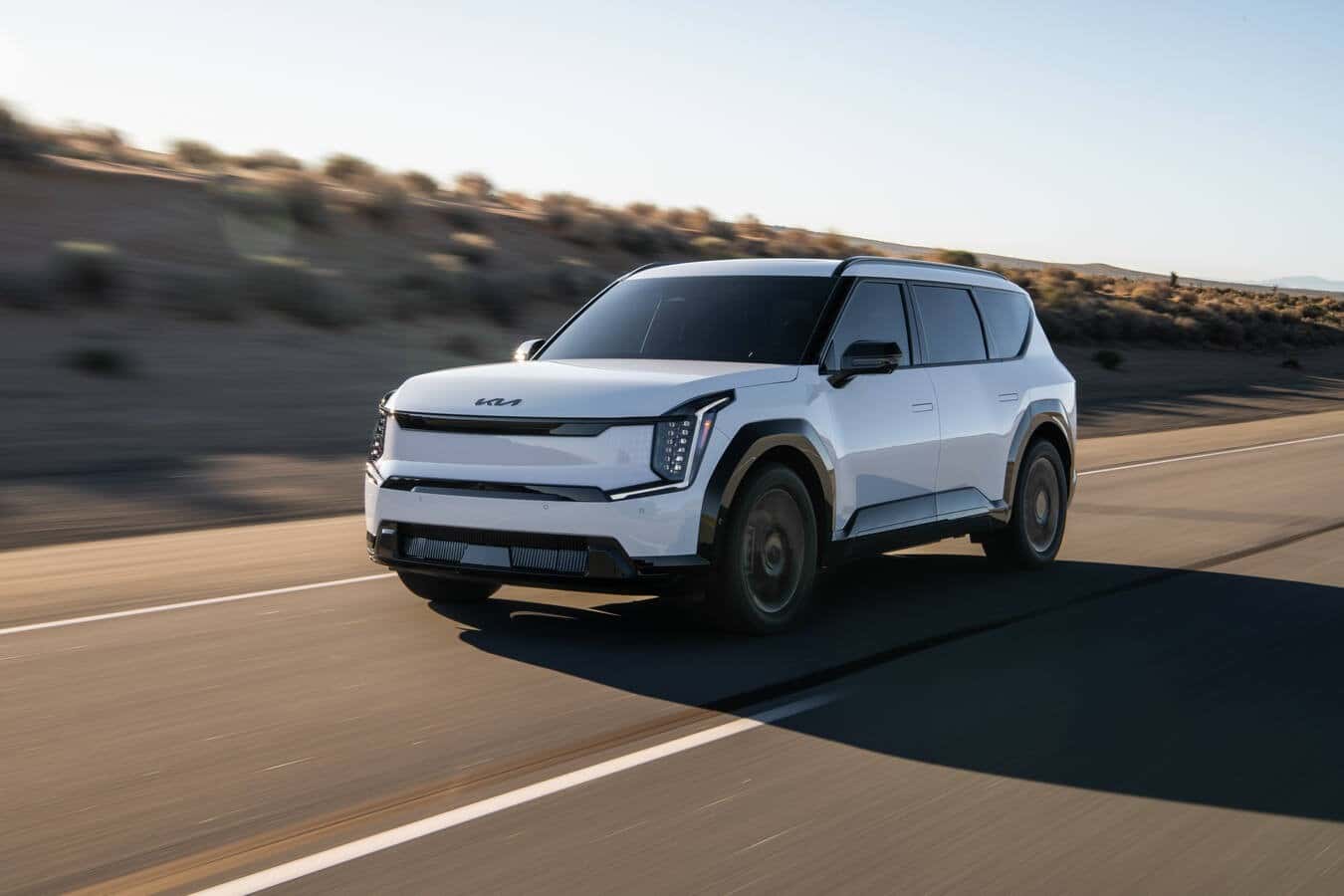 2026 EV9 driving down the road.