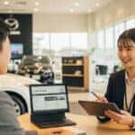 Mazda Finance person at desk