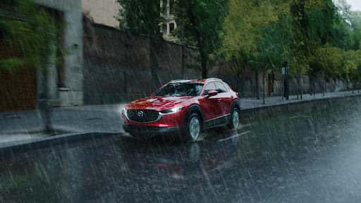 Mazda SUV driving rain