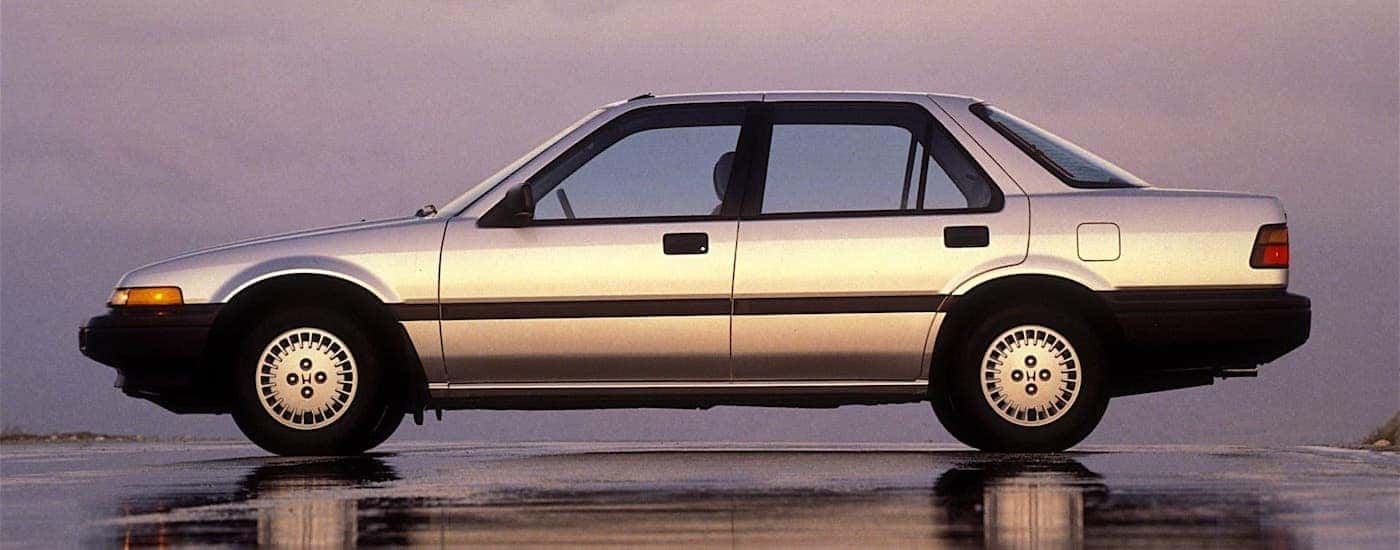Side view of a silver 1986 Honda Accord DX at sunset