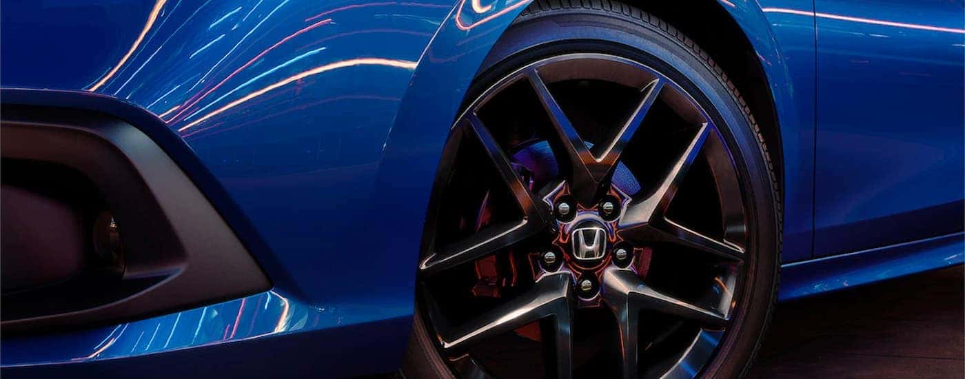 Close up of a front wheel on a blue 2022 Honda Civic Sport