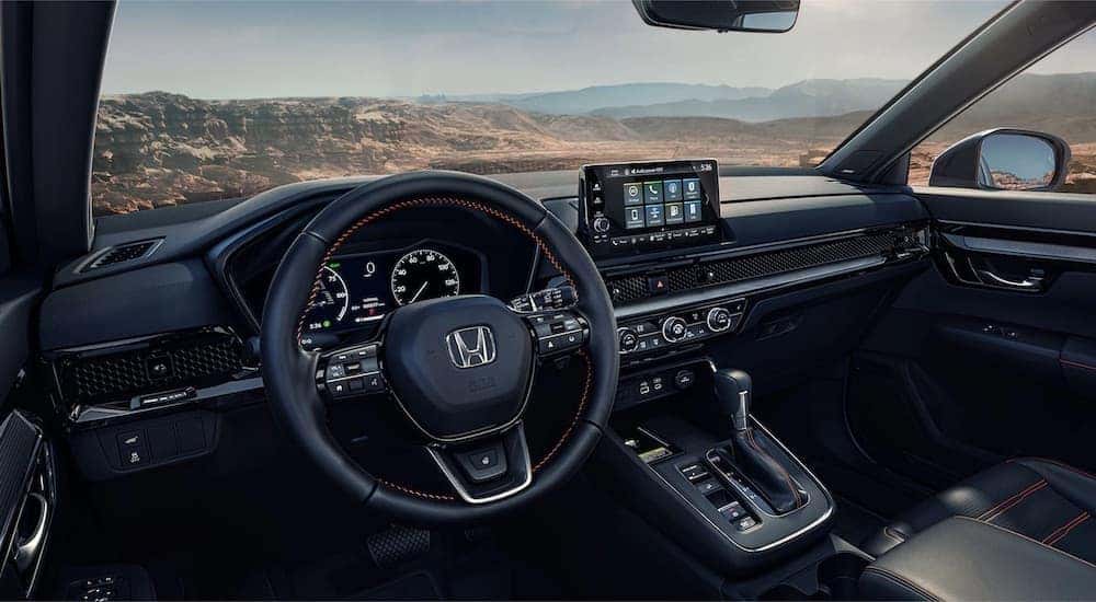 The interior of a 2023 Honda CR-V is shown from the drivers seat.