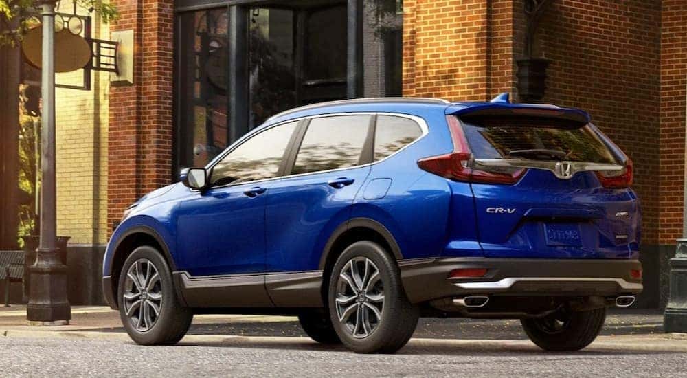 A blue 2020 Honda CR-V is shown parked on a street.