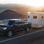 2026 Chevy Silverado truck towing a trailer