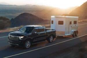 2026 Chevy Silverado truck towing a trailer
