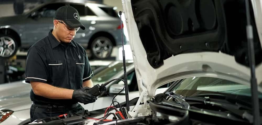 Mercedes-Benz technician testing battery