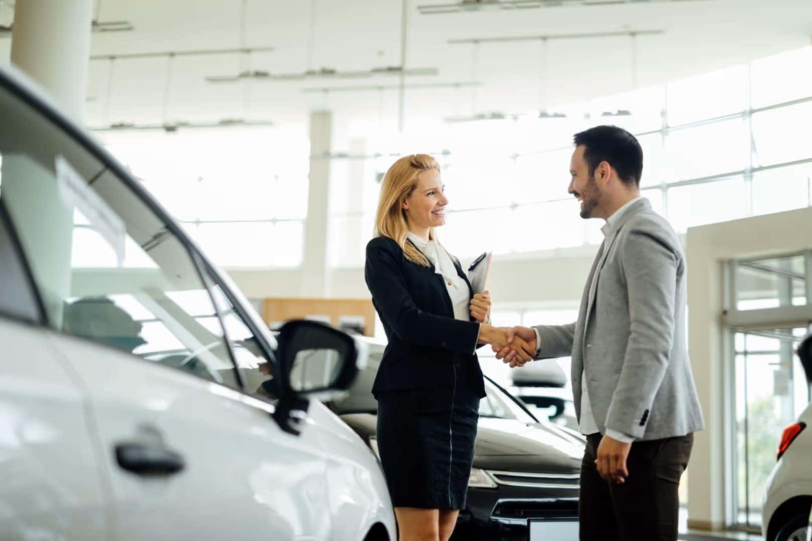 Shaking hands at the car dealership