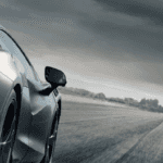2023 McLaren Artura driving on stormy highway