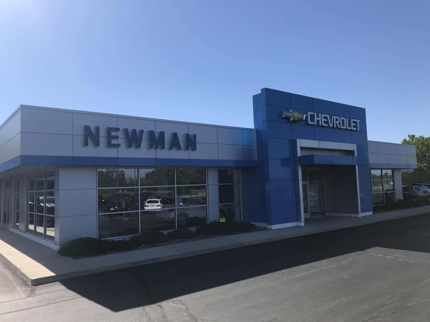 An exterior shot of a Chevrolet dealership at night.