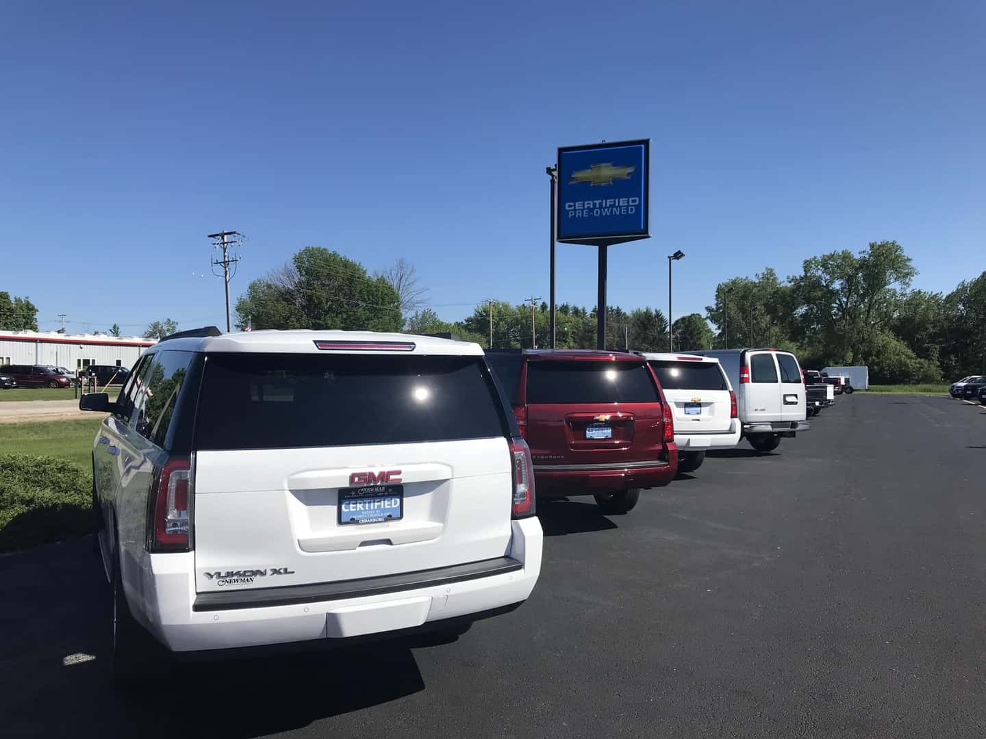 An exterior shot of three cars