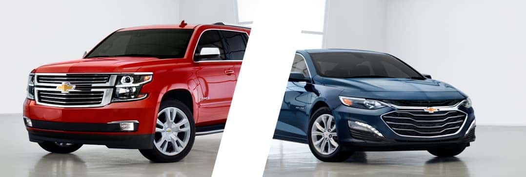 Basic Car Maintenance and Servicing Checklist | Performance Chevrolet | Red Tahoe parked in showroom on left as a blue Malibu is parked on the right