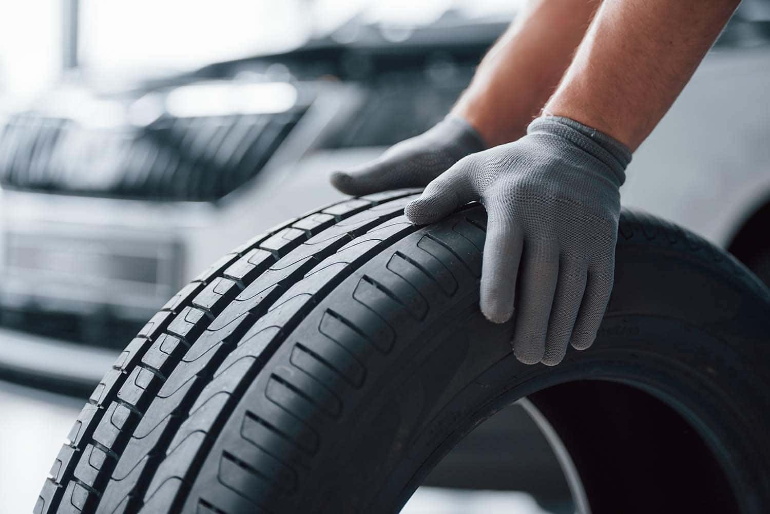How to check your tires' health at Performance Chevrolet | Mechanic putting brand new tire on vehicle