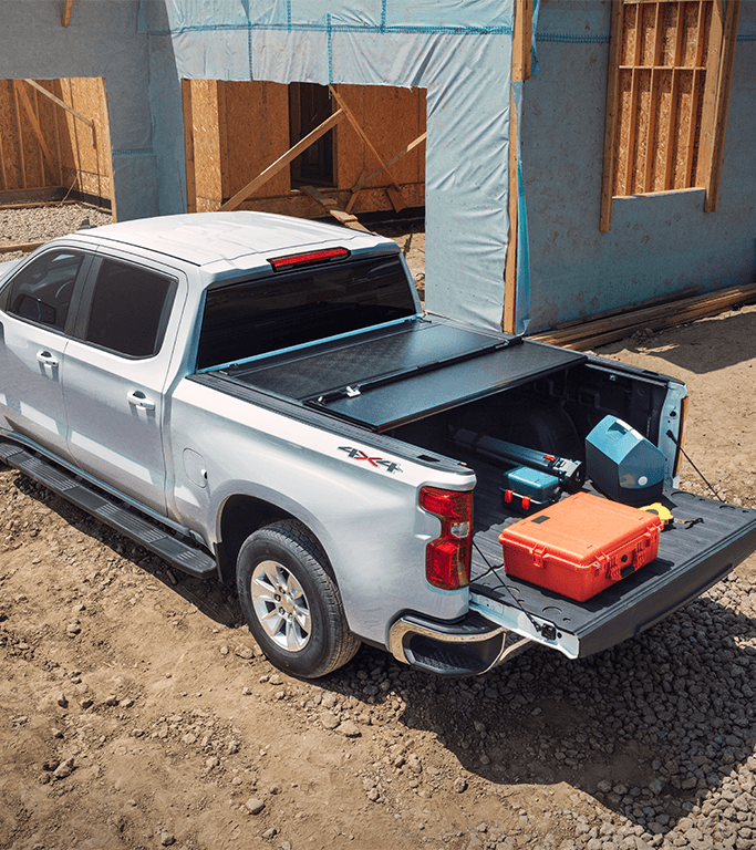 The 2022 Chevrolet Silverado 1500 LTD vs. The 2022 Chevrolet Silverado 1500 at Performance Chevrolet | White Chevy silverado 1500 LTD with trunk open and tool boxes laying on top of trunk 