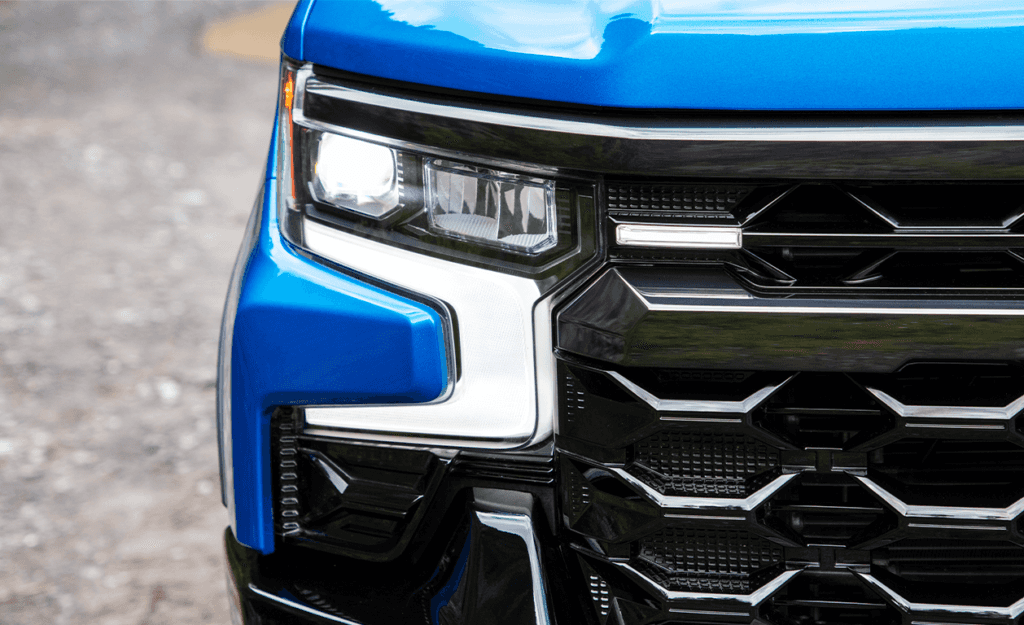 The 2022 Chevrolet Silverado 1500 LTD vs. The 2022 Chevrolet Silverado 1500 at Performance Chevrolet | Detail look of a Chevy silverado 1500 head light in the color blue 