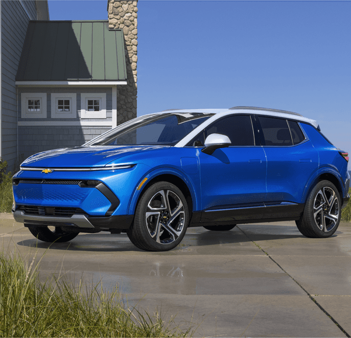 Chevrolet EV’s at Performance Chevrolet | Blue 2023 Chevrolet Equinox EV parked in front of house on a nice sunny day 