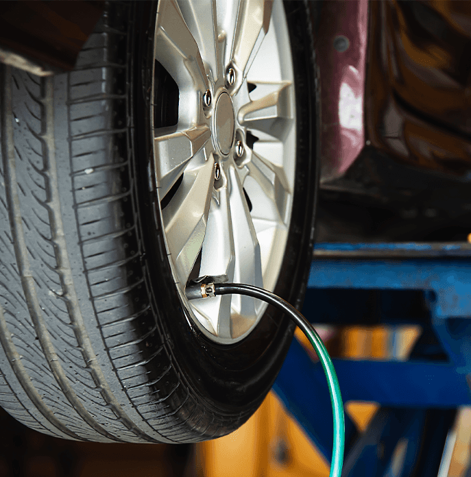 Tire Pressure Information at Performance Chevrolet in Elizabeth City, NC | Air machine cable connected to tire valve to put air into tire