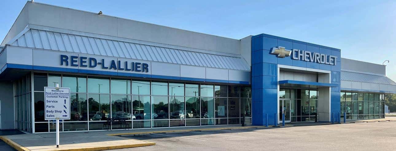 An exterior shot of a Chevrolet dealership at night.