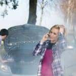 Couple near broken-down car