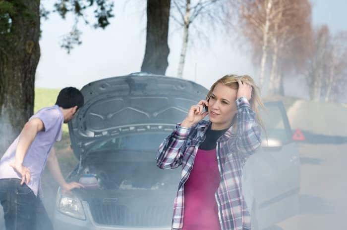 Couple near broken-down car