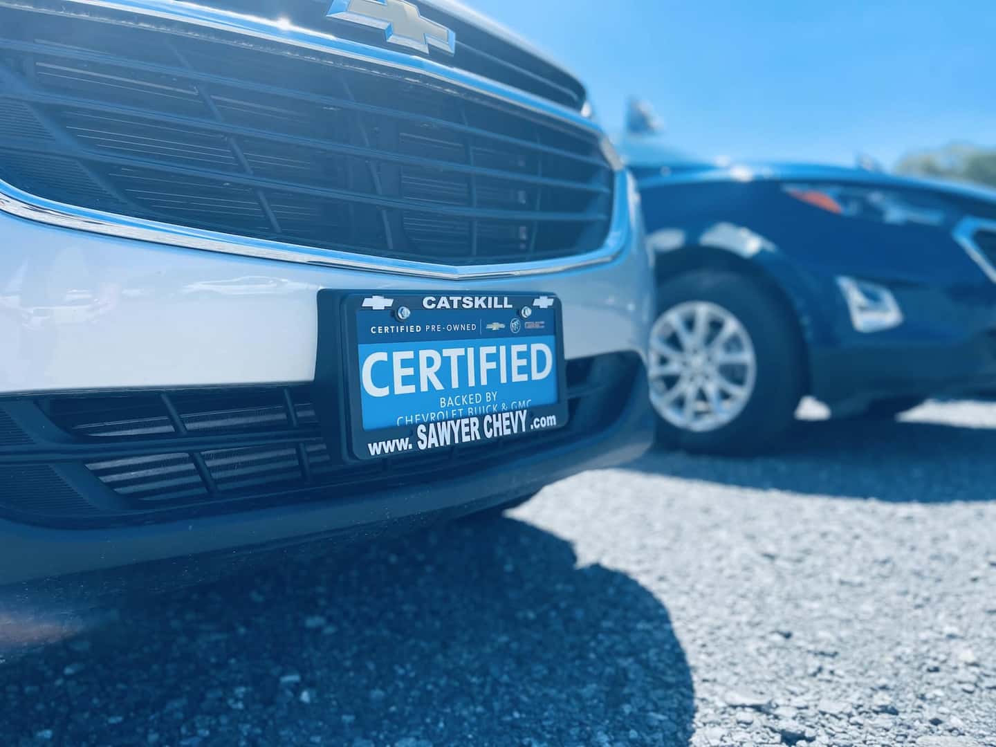 An exterior shot of two Ford trucks