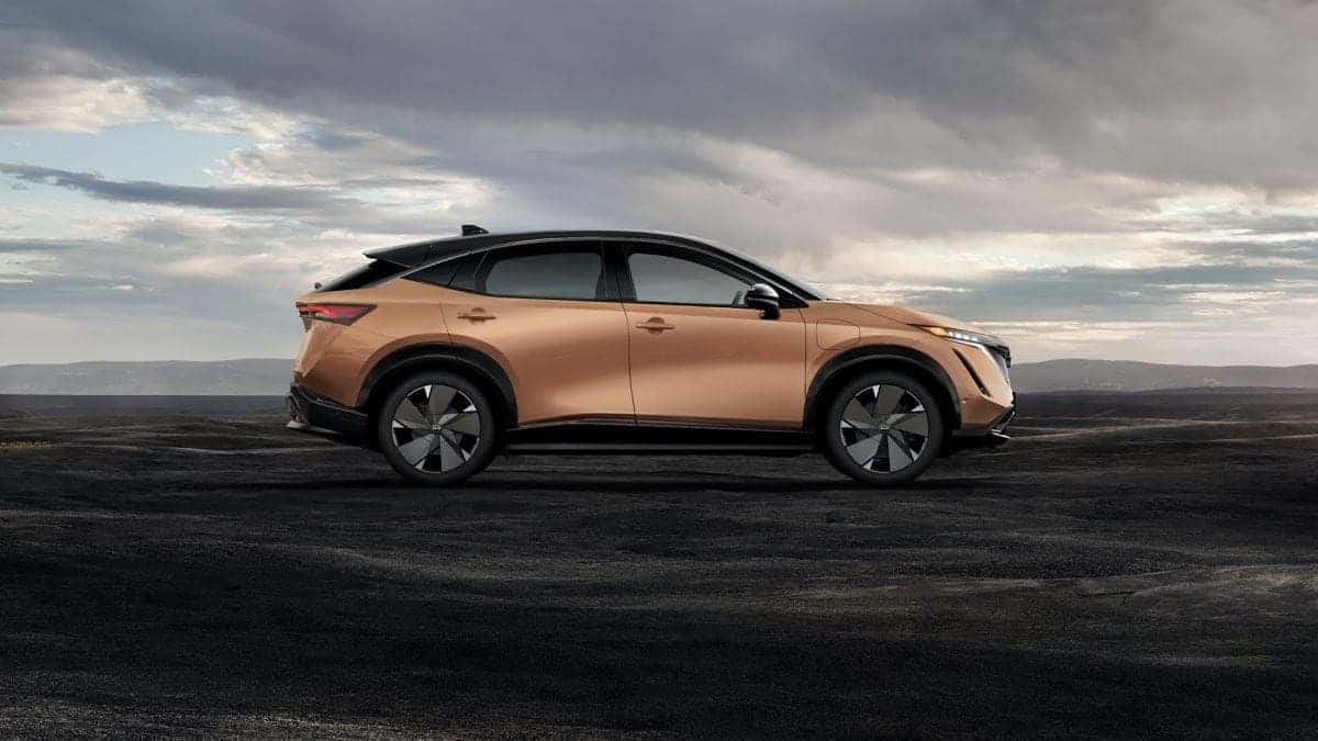 Profile view of red Nissan vehicle