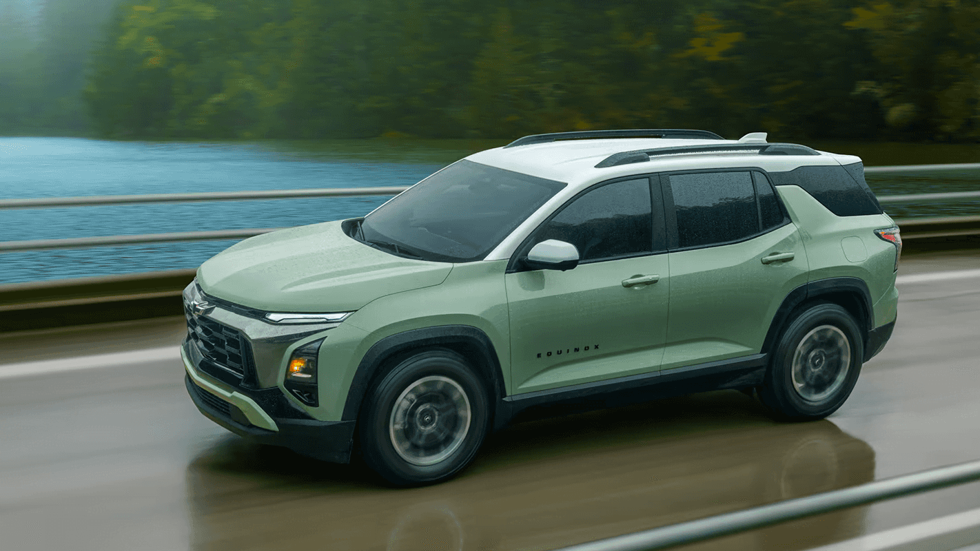 Green 2026 Chevrolet Equinox driving in rain