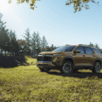 2027 Chevrolet Equinox with a family outside
